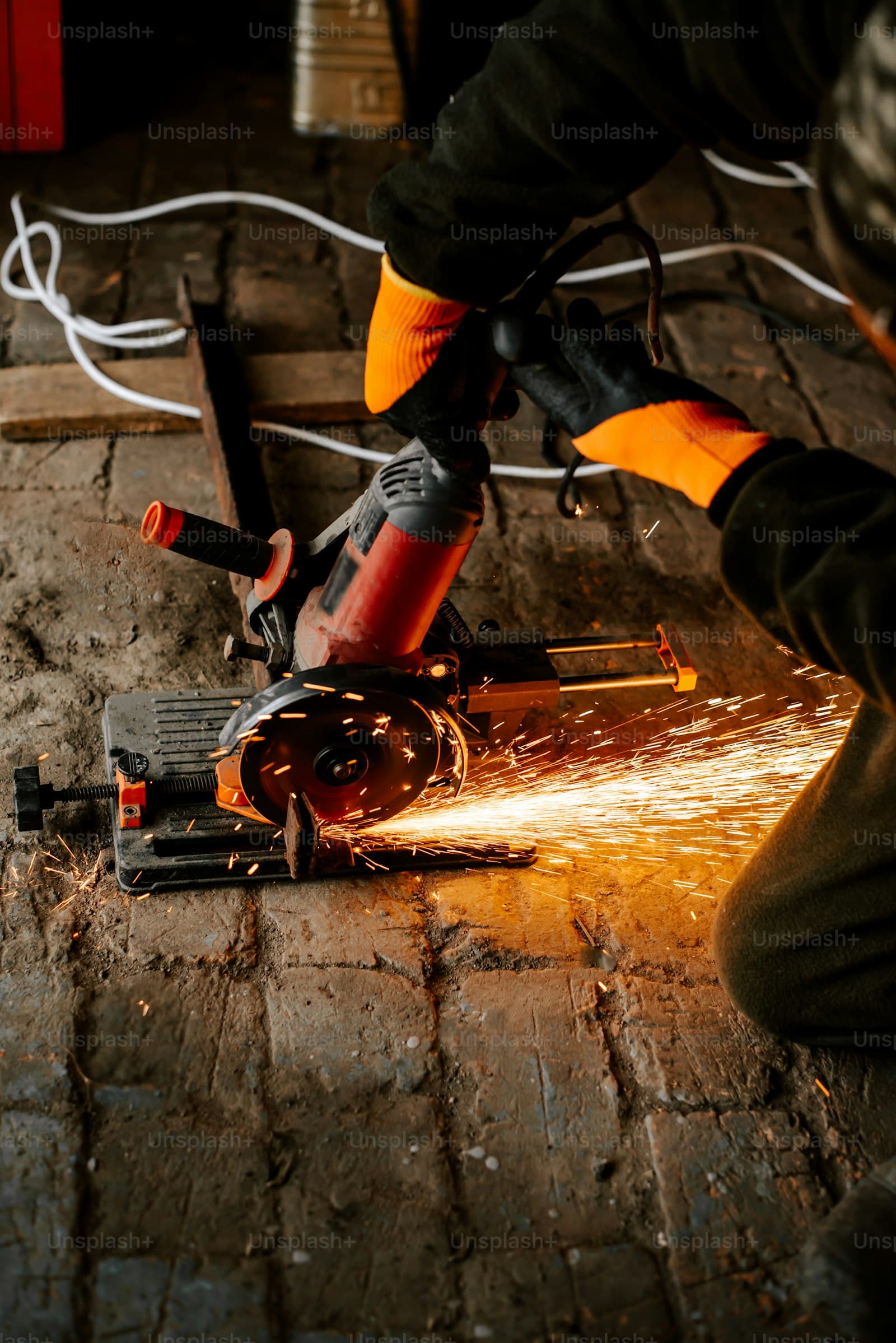 Angle grinder cutting metal with sparks